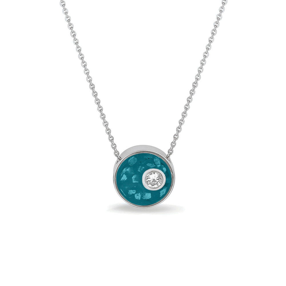 Ashanger rond, gedenksieraad, waar as en haar in verwerkt wordt. Turquoise