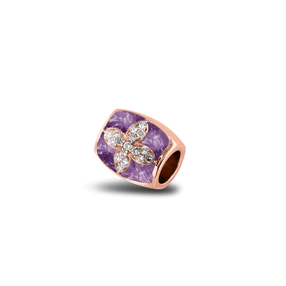 Asbedel met  zirkonia's, aan beide zijdes in twee compartimenten zichtbaar gevuld met as of haar. Purple