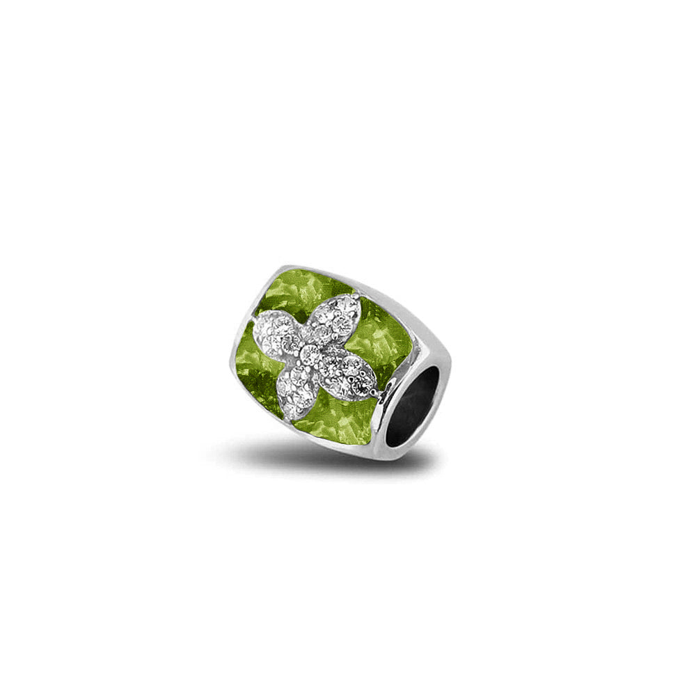 Asbedel met  zirkonia's, aan beide zijdes in twee compartimenten zichtbaar gevuld met as of haar. Green