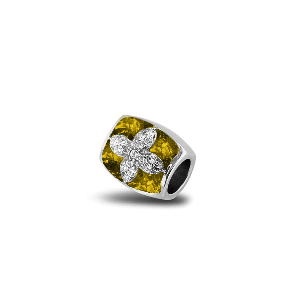 Asbedel met  zirkonia's, aan beide zijdes in twee compartimenten zichtbaar gevuld met as of haar. Yellow