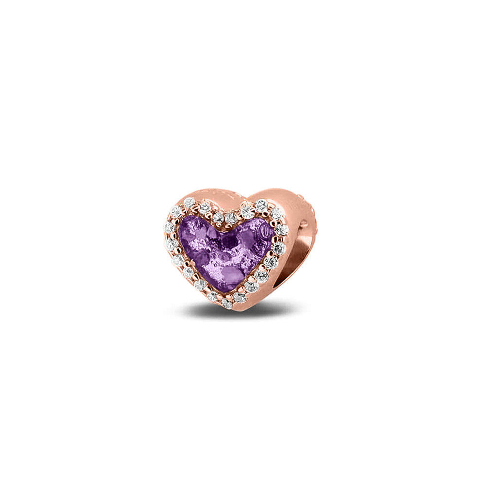 Hartvormige asbedel met  zirkonia's rondom afgewerkt, die aan beide zijdes in twee compartimenten zichtbaar gevuld wordt met as of haar met een keuze in 20 kleuren. Purple