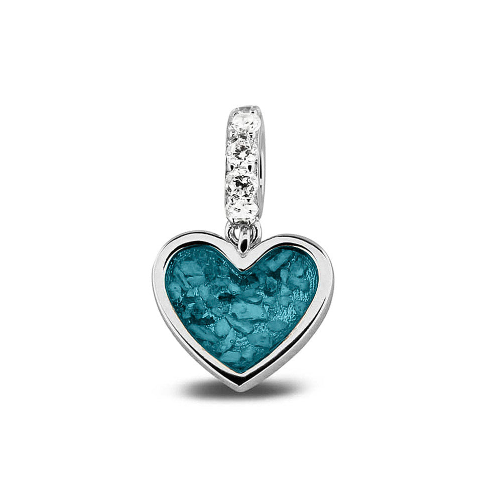 Hartvormige asbedel, het hangoog aan de buitenrand afgewerkt met zirkonia's die aan de voorzijde zichtbaar gevuld wordt met as of haar met een keuze in 20 kleuren. Turquoise