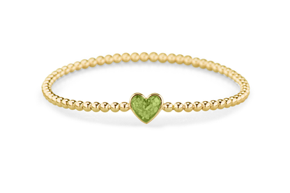 Flexibele as armband met hart als compartiment voor as of haar, gedenksieraden. Green