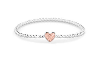 Flexibele as armband met hart als compartiment voor as of haar, gedenksieraden. Blush