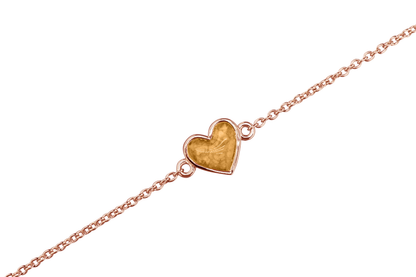 as armband met hartje als gedenksieraad. Gold
