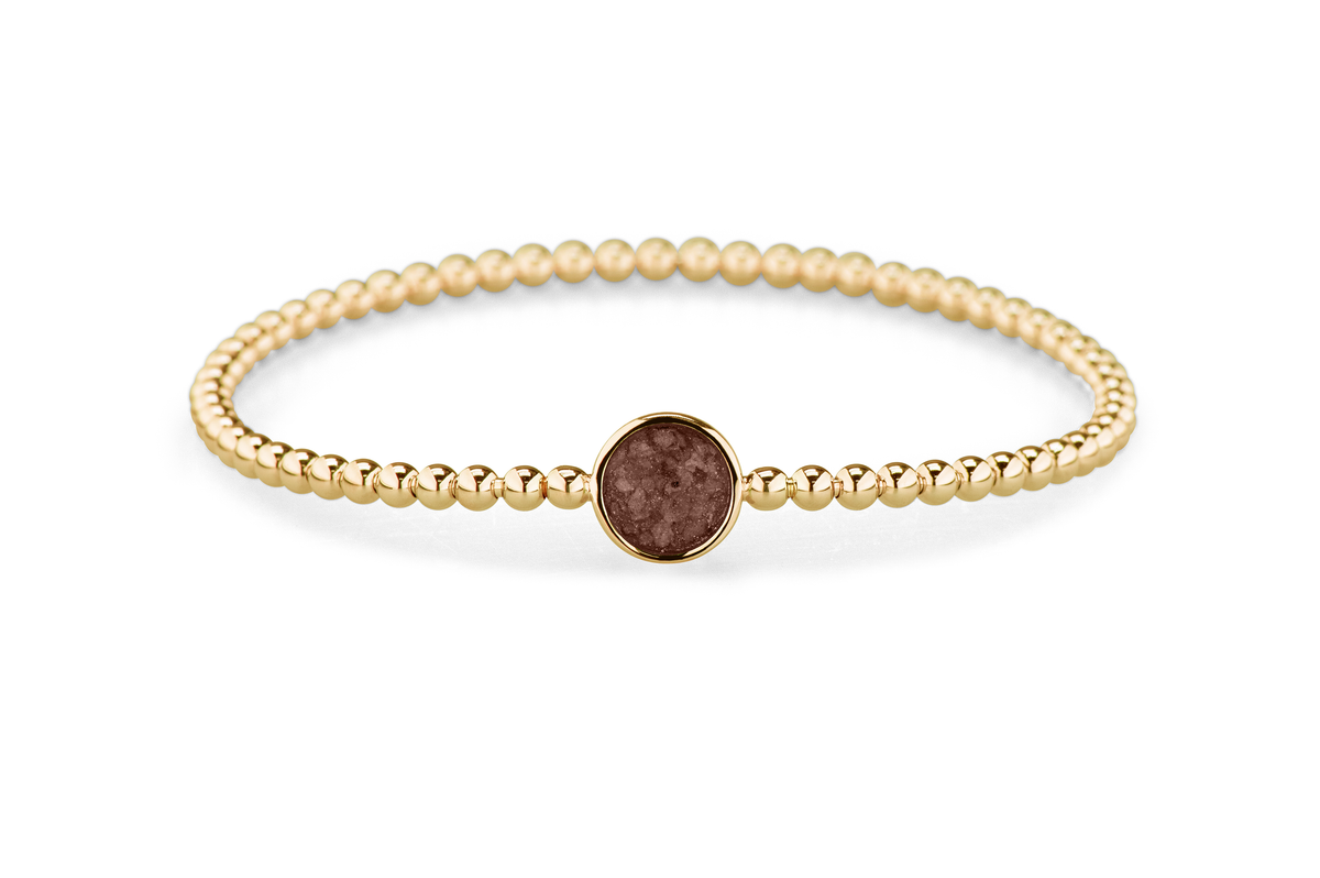 Flexibele as armband met rondje als compartiment voor as of haar, gedenksieraden. Brown