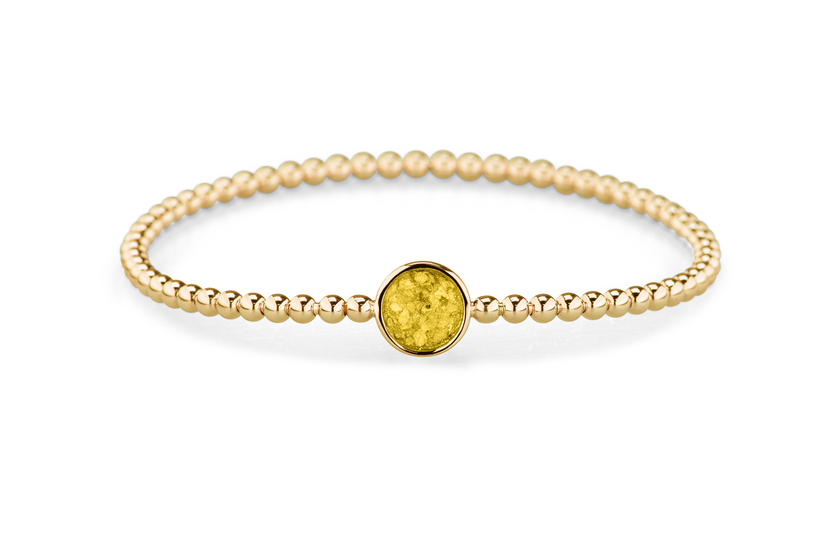 Flexibele as armband met rondje als compartiment voor as of haar, gedenksieraden. Yellow