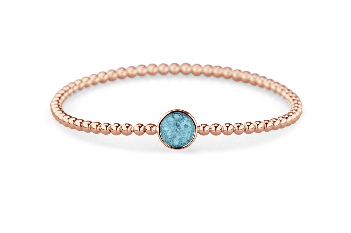 Flexibele as armband met rondje als compartiment voor as of haar, gedenksieraden. Baby