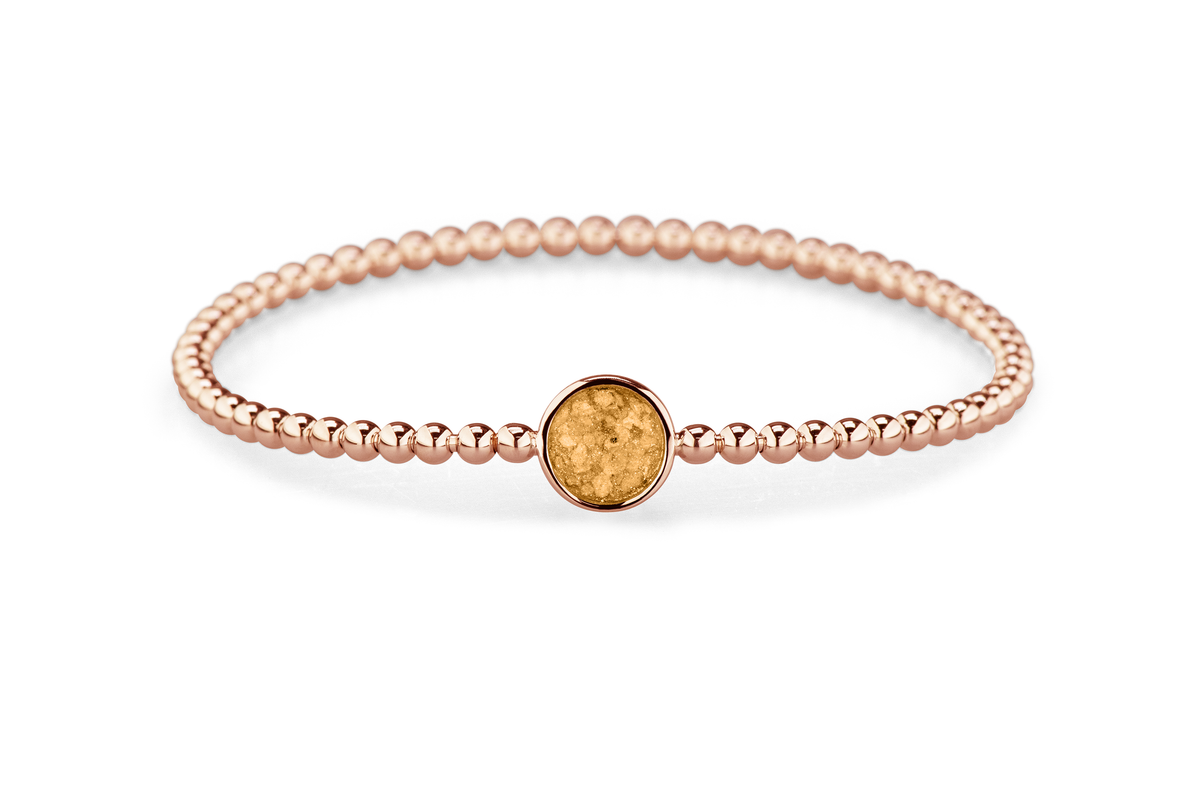 Flexibele as armband met rondje als compartiment voor as of haar, gedenksieraden. Gold