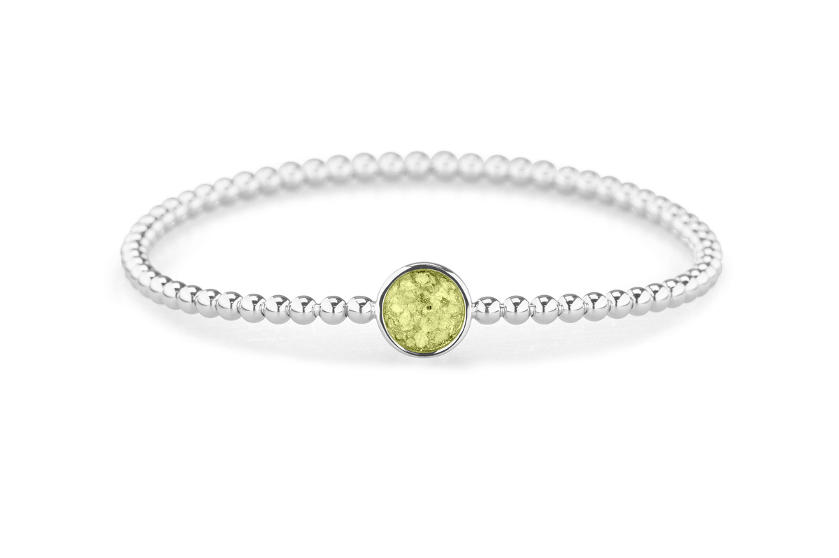 Flexibele as armband met rondje als compartiment voor as of haar, gedenksieraden. Olive