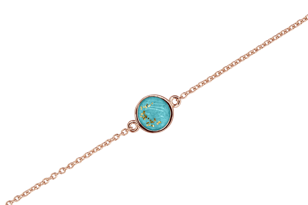 As armband met rondje als compartiment in het midden aan de voorzijde. Aqua