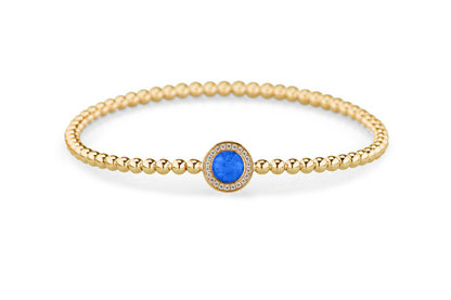 Flexibele as armband met rondje als compartiment gezet rondom met zirconia's voor as of haar. Blue