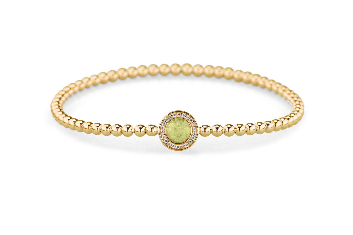 Flexibele as armband met rondje als compartiment gezet rondom met zirconia's voor as of haar. Olive