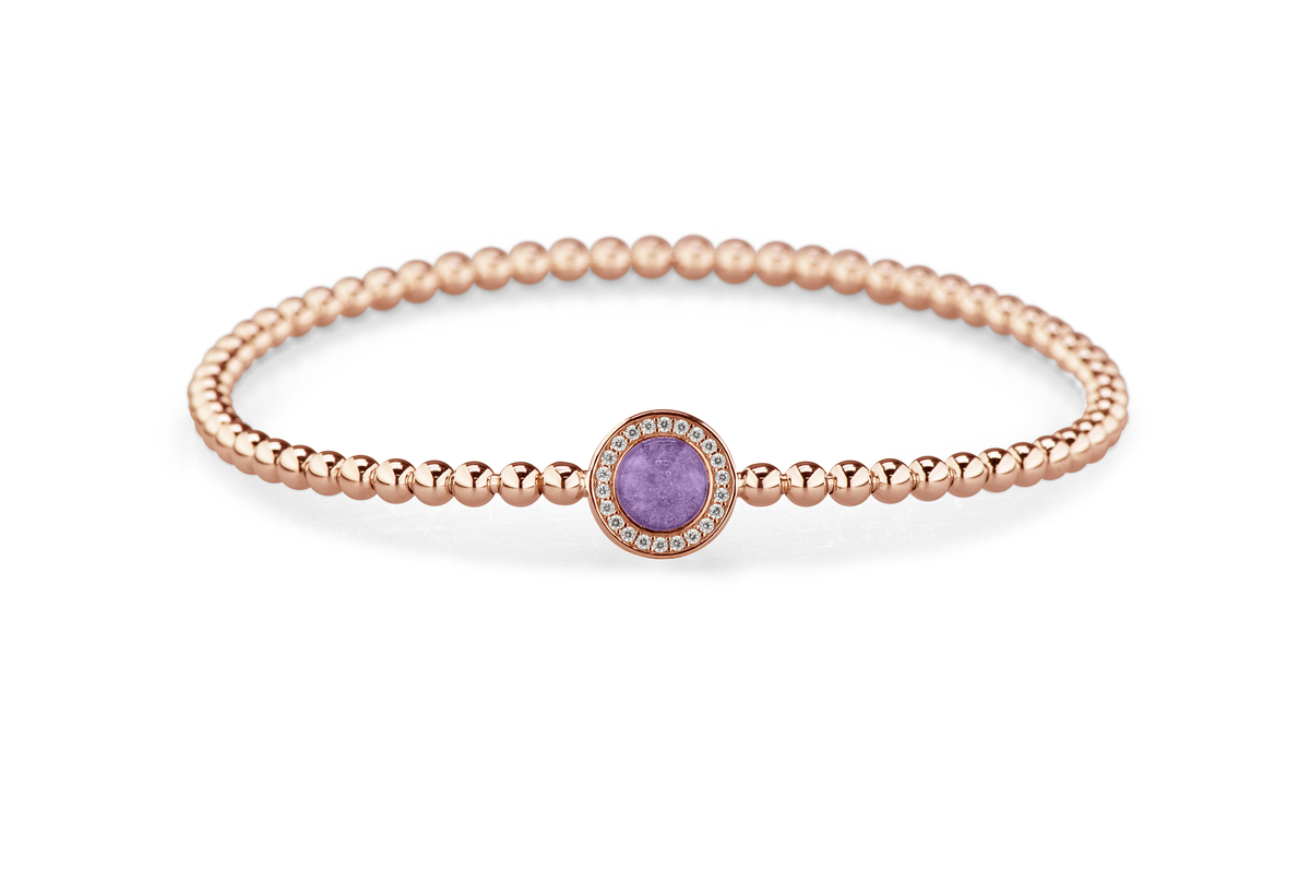 Flexibele as armband met rondje als compartiment gezet rondom met zirconia's voor as of haar. Purple