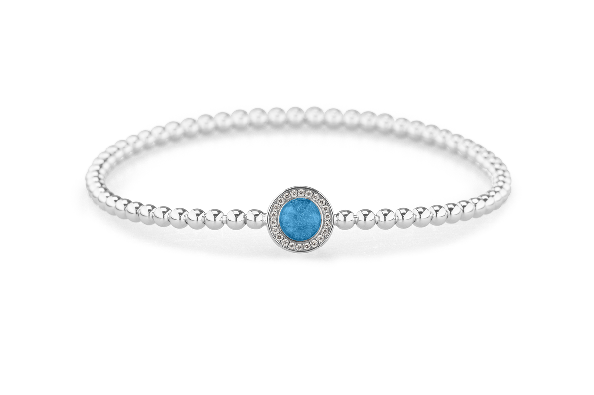 Flexibele as armband met rondje als compartiment gezet rondom met zirconia's voor as of haar. Marine