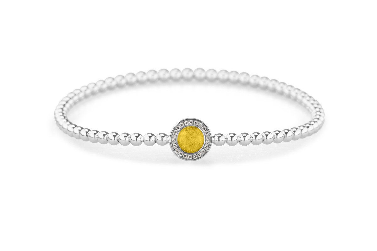 Flexibele as armband met rondje als compartiment gezet rondom met zirconia's voor as of haar. Yellow