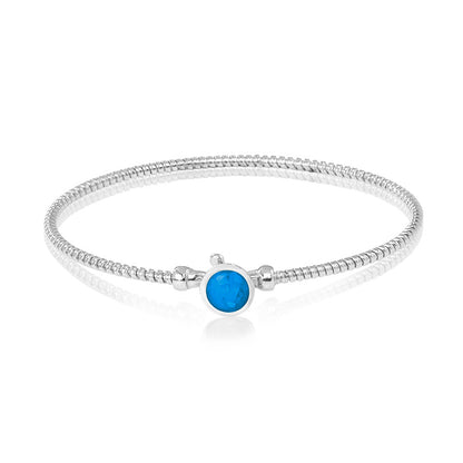 Zilveren as armband met in het midden een ornamentje, gedenksieraad. Marine