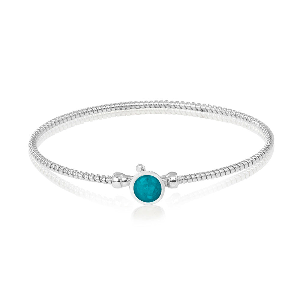 Zilveren as armband met in het midden een ornamentje, gedenksieraad. Turquoise