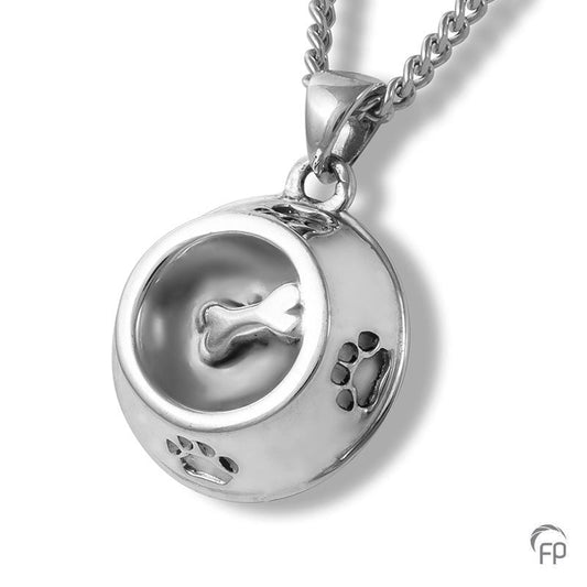 Deze zilveren 925 sterling ashanger met pootafdruk kenmerkt zich door het fraai en speels ontworpen karakter. Dit gedenksieraad kan met as en ook met haar van je huisdier gevuld worden.